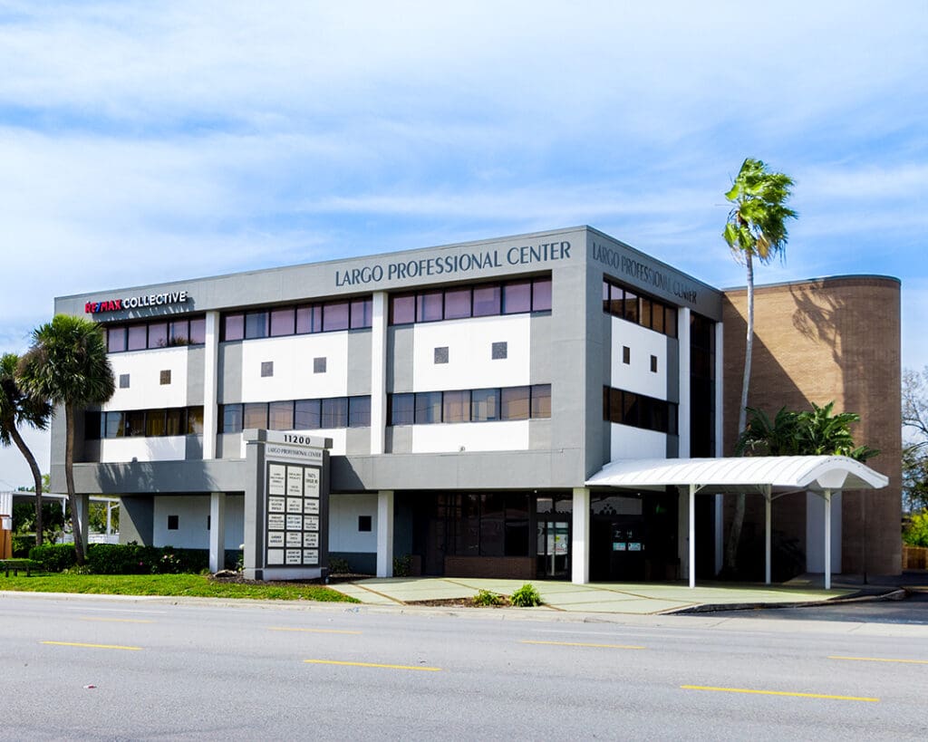 Our podiatrist Tampa Largo branch is housed in the Largo Professional Center, a modern facility with large white panels and inviting warm lighting.