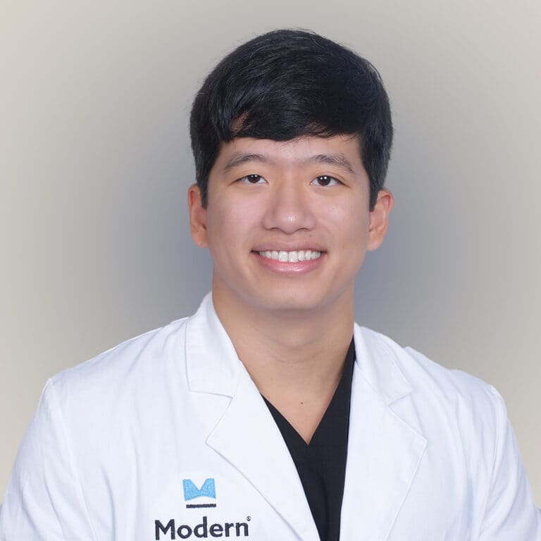 A photo of Dr. Huynh in the clinic, known for his attention to individualized care and experience of lower extremity pathologies.