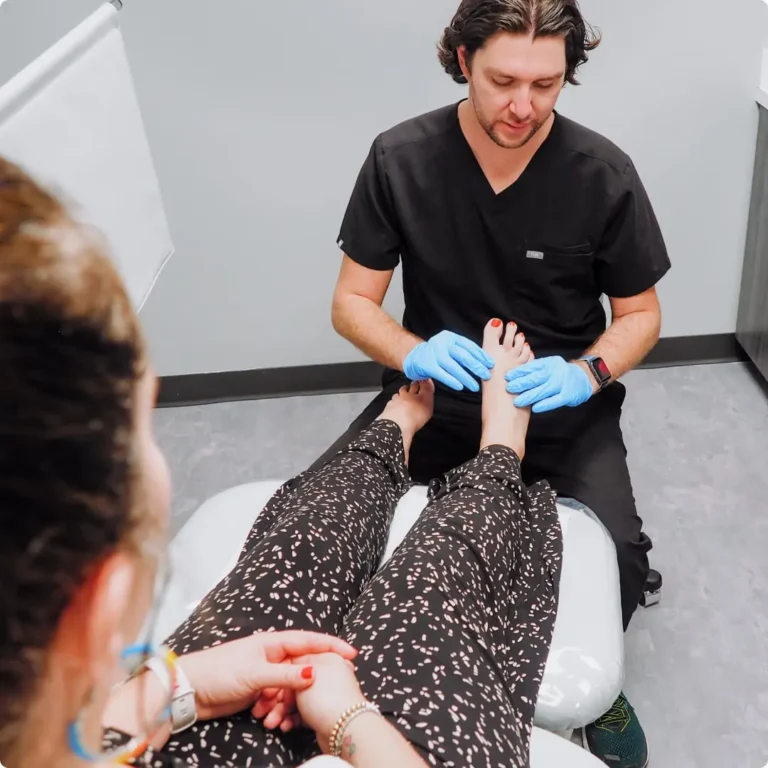 Image of a doctor examining a patient's foot.