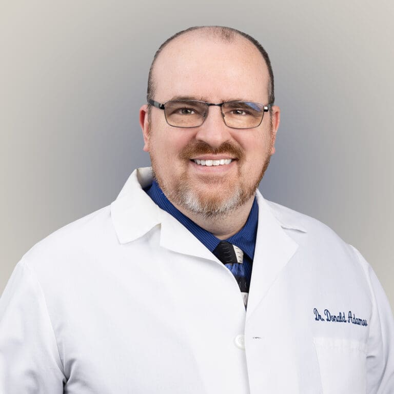 Portrait of Dr. Donald Adamov, a board-certified Podiatric Surgeon in Spring Hill, celebrated for his innovative approach to minimally-invasive foot surgeries and expertise in diabetic foot care.