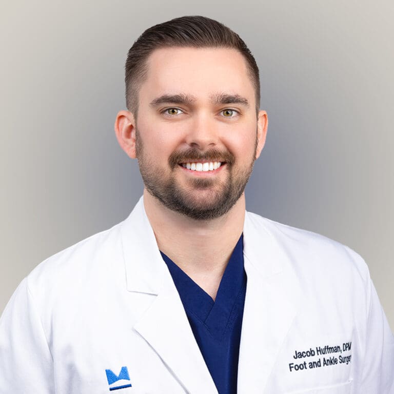 Close-up image of Dr. Jacob Huffman, a male Board Certified Podiatrist in Orlando, known for his expertise in sports medicine and minimally-invasive surgeries.