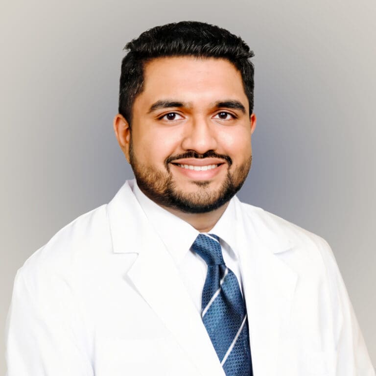 Portrait of Dr. Divyesh Mehta, a male podiatrist in Orlando, Florida, specializing in sports medicine and diabetic reconstruction.