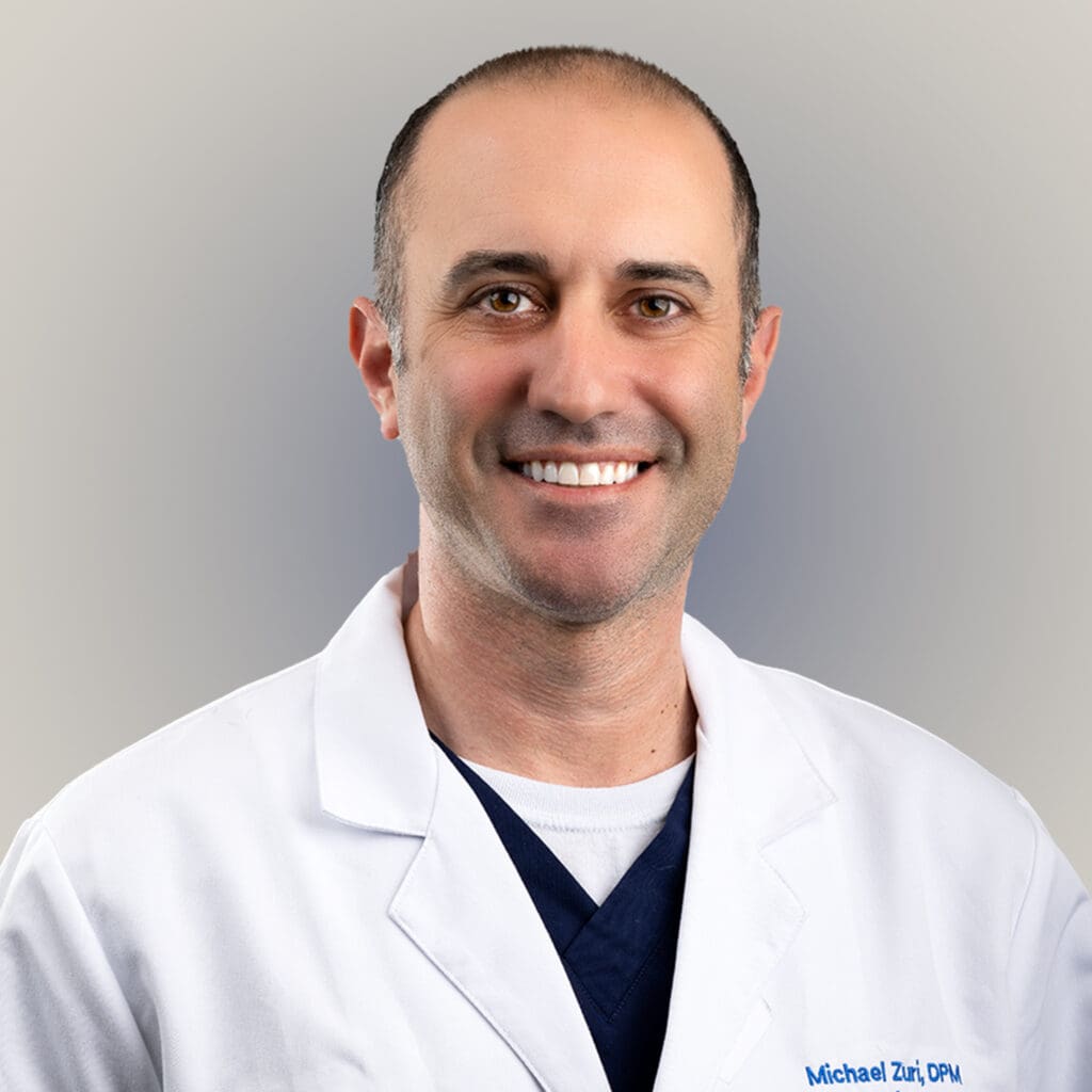 Portrait of Dr. Michael Zuri, a male Board Certified Podiatrist in Tampa, specializing in sports injuries and endoscopic plantar fasciotomies for heel pain.