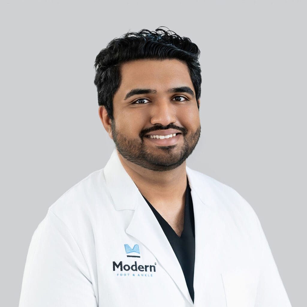 Portrait of Dr. Divyesh Mehta, a male podiatrist in Orlando, Florida, specializing in sports medicine and diabetic reconstruction.