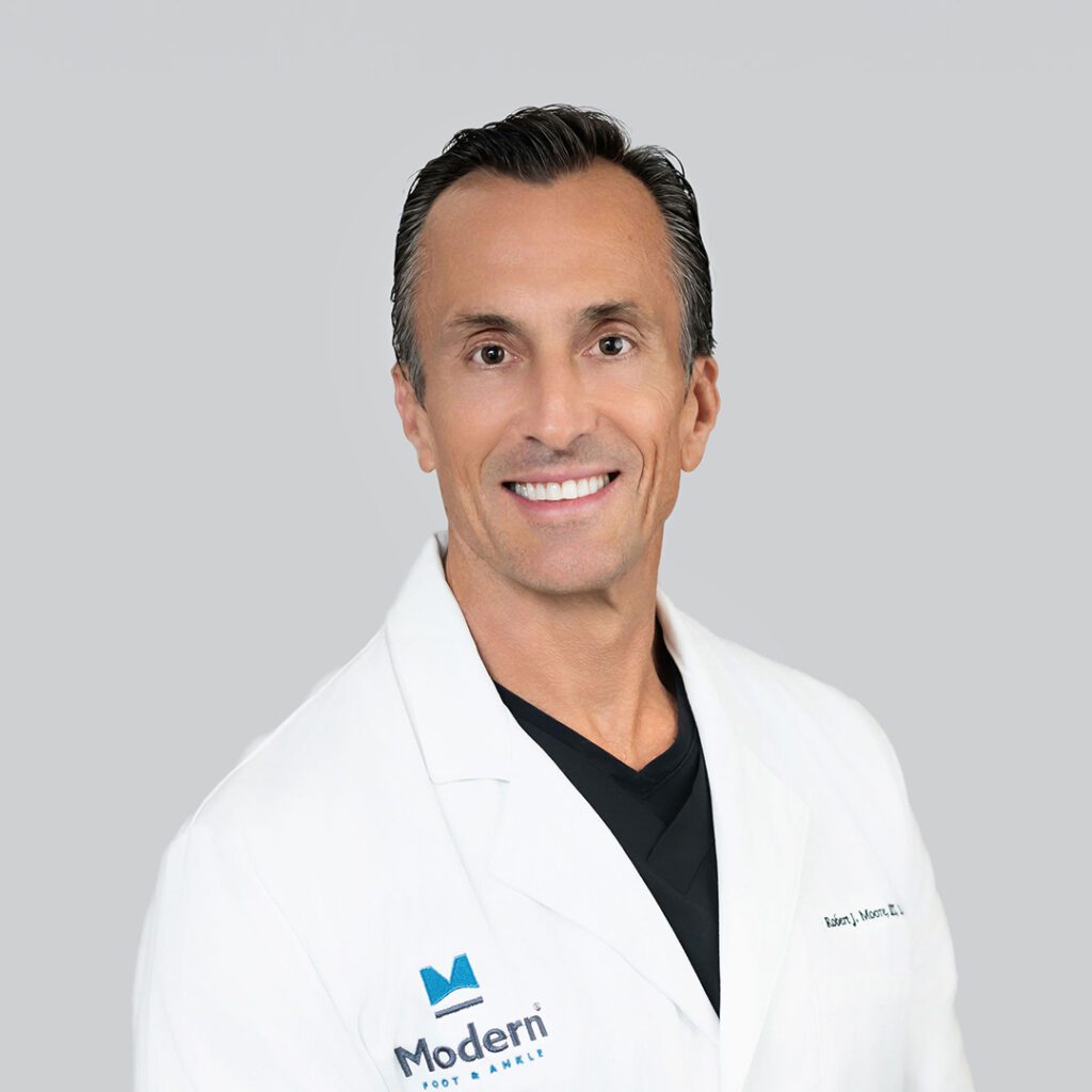 Dr. Moore, a Spring, Texas-based board-certified Podiatrist, known for comprehensive care in all foot and ankle conditions with a focus on advanced surgical methods.